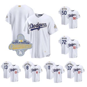 May include: White baseball jerseys with the Los Angeles Dodgers logo and player names and numbers. The jerseys include the text "Dodgers" in blue script, and a patch that says "20 25 World Series Champions".