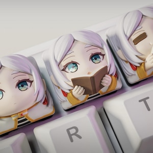 May include: A trio of ceramic mugs with a speckled, matte finish in cream, light grey, and dark grey. Each mug has a simple, minimalist design and a rounded handle. Suitable for tea or coffee, these mugs offer a modern aesthetic.