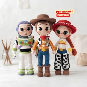 May include: Three amigurumi dolls featuring a space ranger in a white, green, and purple suit, a cowboy in a brown hat, yellow shirt, and blue pants, and a cowgirl in a red hat, white shirt, and cow-print pants. Text reads PDF CROCHET PATTERN.