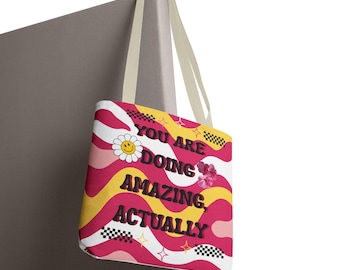 Bolso de tela con el lema "Lo estás haciendo increíble" / diseño de margaritas