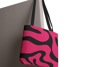 Bolso tote con estampado de camuflaje abstracto en rosa fucsia y negro.