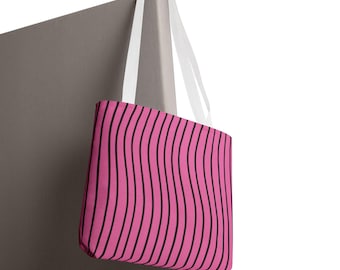 Bolso tote rosa con rayas onduladas y estampado de líneas curvas negras.