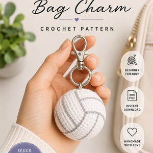 May include: A white and gray crochet volleyball bag charm, approximately 3 inches in diameter, with a silver-colored clasp. The text "VOLLEYBALL Bag Charm CROCHET PATTERN" is displayed at the top. The image also includes text that says "Quick Project Makes a Great Gift!"