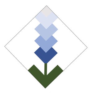 May include: A geometric floral design featuring a series of blue diamond shapes, graduating in color from light to dark, atop a green stem. The design is enclosed within a white diamond outline, set against a white background.