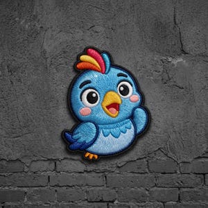 May include: An embroidered patch featuring a cartoon bird with bright blue feathers, a yellow beak, and a crest with red, orange, and yellow stripes. The bird has large black eyes, pink cheeks, and a black border outlining its rounded shape.
