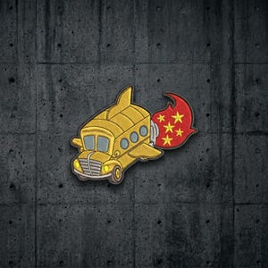 May include: An embroidered patch featuring a yellow school bus with wings and a tail fin, designed to look like an airplane. The bus has a red exhaust plume trailing from the back, decorated with five yellow stars arranged in a circular pattern.