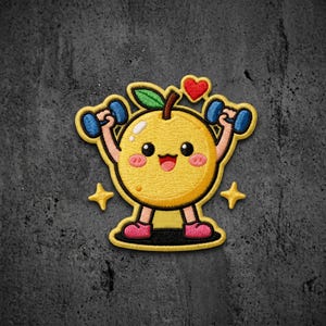 May include: An embroidered patch featuring a yellow cartoon fruit character with a smiling face, pink cheeks, and a green leaf on top. The character is lifting two blue dumbbells, with a small red heart above and two yellow stars on the sides.