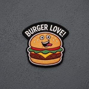 May include: An embroidered patch featuring a cartoon hamburger with a smiling face and tongue sticking out. The text BURGER LOVE! is arched in white capital letters on a black background above the burger, which has layers of bun, patty, cheese, and lettuce.