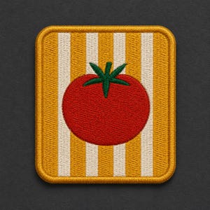 May include: A square embroidered patch featuring a red tomato with a green stem centered on a background of vertical yellow and white stripes. The patch has a thick, raised yellow border with rounded corners and a textured, stitched finish.