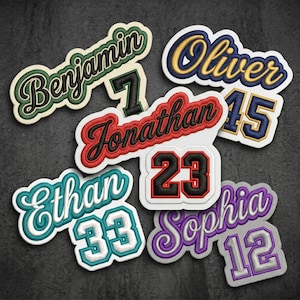 May include: A collection of embroidered patches featuring names and numbers in various colors. The names Benjamin, Oliver, Jonathan, Ethan, and Sophia are written in script, paired with the numbers 7, 15, 23, 33, and 12 in block fonts.