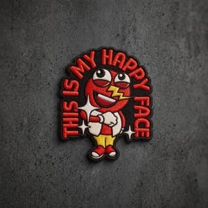 May include: An embroidered patch featuring a red cartoon character with a wide grin, a yellow lightning bolt over one eye, and white gloves. The text THIS IS MY HAPPY FACE is stitched in red around the character, accented by white star shapes.