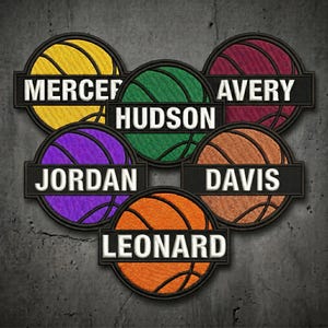 May include: Six circular embroidered patches featuring basketball designs in yellow, green, maroon, purple, orange, and light orange. Each patch has a black horizontal bar with white embroidered text reading MERCER, HUDSON, AVERY, JORDAN, DAVIS, and LEONARD.