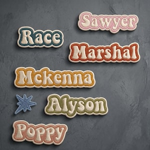 May include: A collection of embroidered name patches featuring the names Sawyer, Race, Marshal, Mckenna, Alyson, and Poppy in various colors including pink, teal, orange, yellow, green, and peach, alongside a small blue star-shaped patch.