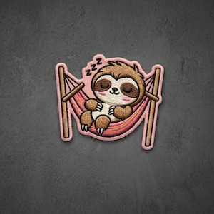 May include: An embroidered patch featuring a brown sloth with closed eyes sleeping in a pink hammock. The sloth has a white face, pink cheeks, and dark brown fur. Three black letter Zs are positioned above the sloth to indicate sleep.