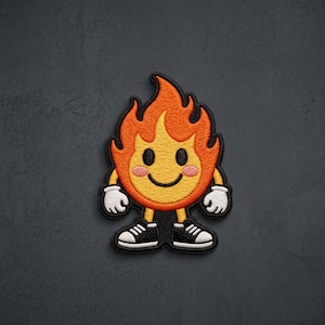 May include: An embroidered patch featuring a cartoon flame character with a yellow face, orange hair, and pink cheeks. The character has a black smile, white gloves, and black sneakers with white laces and soles, all outlined in thick black thread.