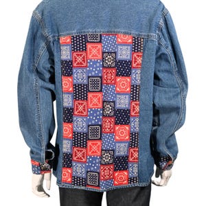 May include: A blue denim jacket with a patchwork back panel featuring a red, white, and blue bandana print.