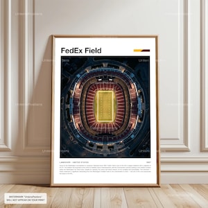 May include: A framed print featuring an aerial view of FedEx Field, a football stadium. The image shows the field's green playing surface surrounded by seating. The text "FedEx Field" is at the top, with "LANDOVER - UNITED STATES" below.