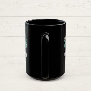 Handle side of a mug showing that the design is on both sides.