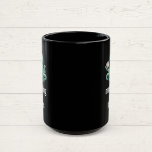Front of a mug showing that the design is on both sides.