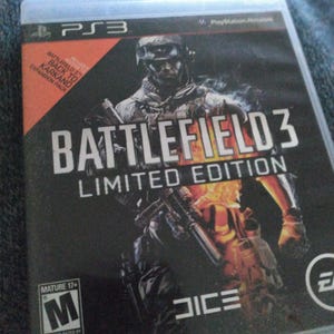 May include: A PlayStation 3 game case for Battlefield 3: Limited Edition. The cover features a soldier in combat gear with a fiery background. Includes the text "BATTLEFIELD 3 LIMITED EDITION" and "MATURE 17+".