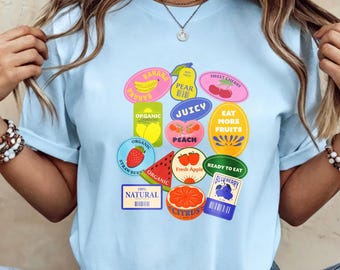 Colorful Vintage Fruit Sticker Collage Tee, Retro Produce Labels Print Light Blue Crew Neck Shirt for Food Lovers