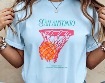 Koszulka z nadrukiem klubu koszykówki San Antonio, jasnoniebieska, z okrągłym dekoltem i nadrukiem w stylu retro dla kibiców