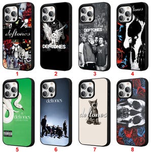 May include: A collection of black phone cases featuring various designs. The cases showcase images of a band, a skull, a cat, and an owl. Some cases have the band's name, "Deftones," printed on them.