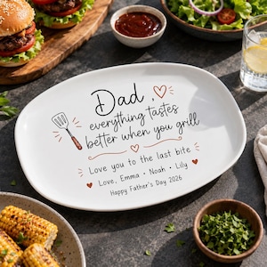 May include: White oval platter with the text "Dad, everything tastes better when you grill." Includes a spatula illustration and the message "Love you to the last bite." with names and "Happy Father's Day 2026."