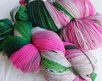 Hand spun gradient yarn nature inspired in green to pink to magenta colors