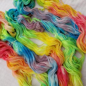 All purpose wool yarn worsted weight hand dyed in neon rainbow colors; Rainbow Connection Variations Collection #5