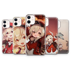 May include: A white ceramic mug with a black handle and the text "But First, Coffee" in a black, handwritten-style font. The mug is on a white surface.