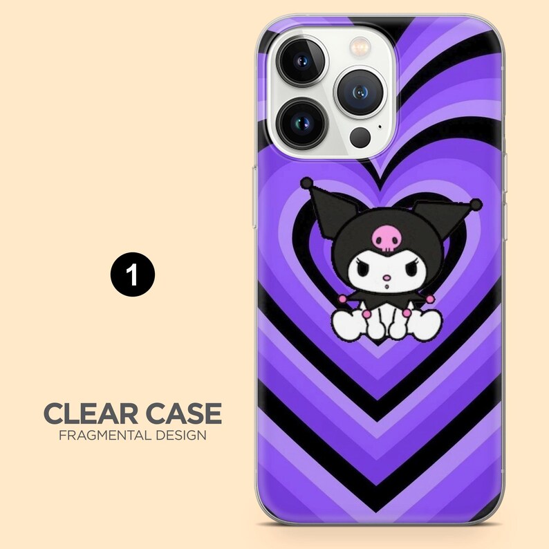 May include: A clear phone case with a purple and black heart design. The case features a cartoon character with a black hat and a pink skull. The text "CLEAR CASE FRAGMENTAL DESIGN" is visible.