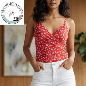 May include: A red camisole top with a white floral pattern. The top has thin straps and a wrap-style front. The model is wearing white jeans. The logo "SEWINGBYTEHSEEN" is in the upper left corner.