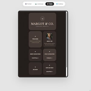 May include: A digital tablet screen shows a website design in dark brown and beige. The website features the logo "MARGOT & CO." and navigation buttons such as "Welcome" and "About Me".