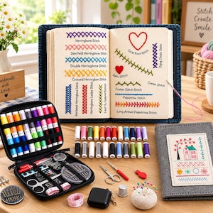 May include: A comprehensive embroidery kit featuring an open case with colorful thread spools, needles, scissors, and a measuring tape. An open instructional book displays various stitch types with labels, and a gray fabric cover features a house design.