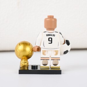 May include: A handmade wooden sign with the text "Welcome to our home" in a handwritten style. The sign is painted white with a dark stained frame. A small, decorative heart is attached to the bottom.