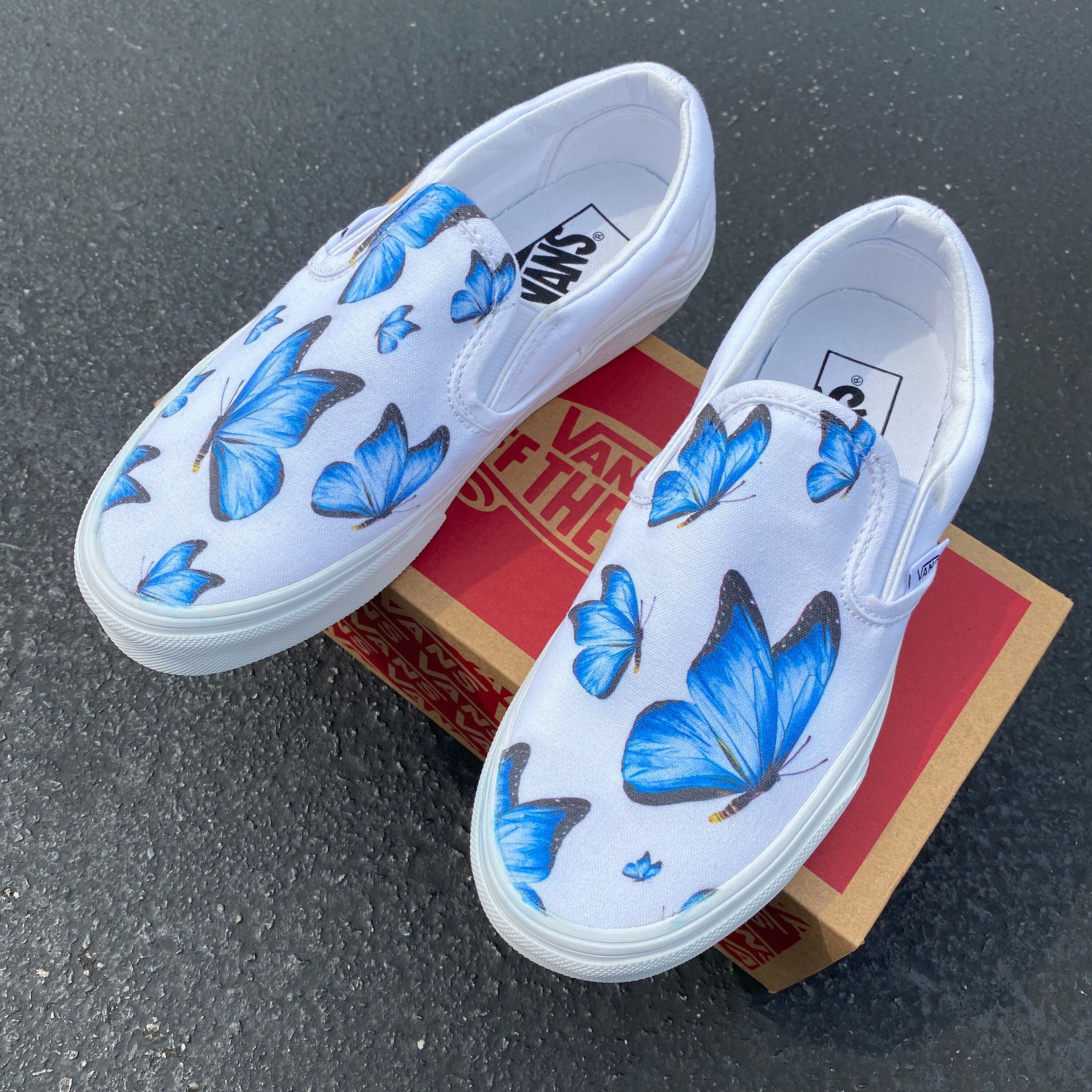 white slip on vans with butterflies