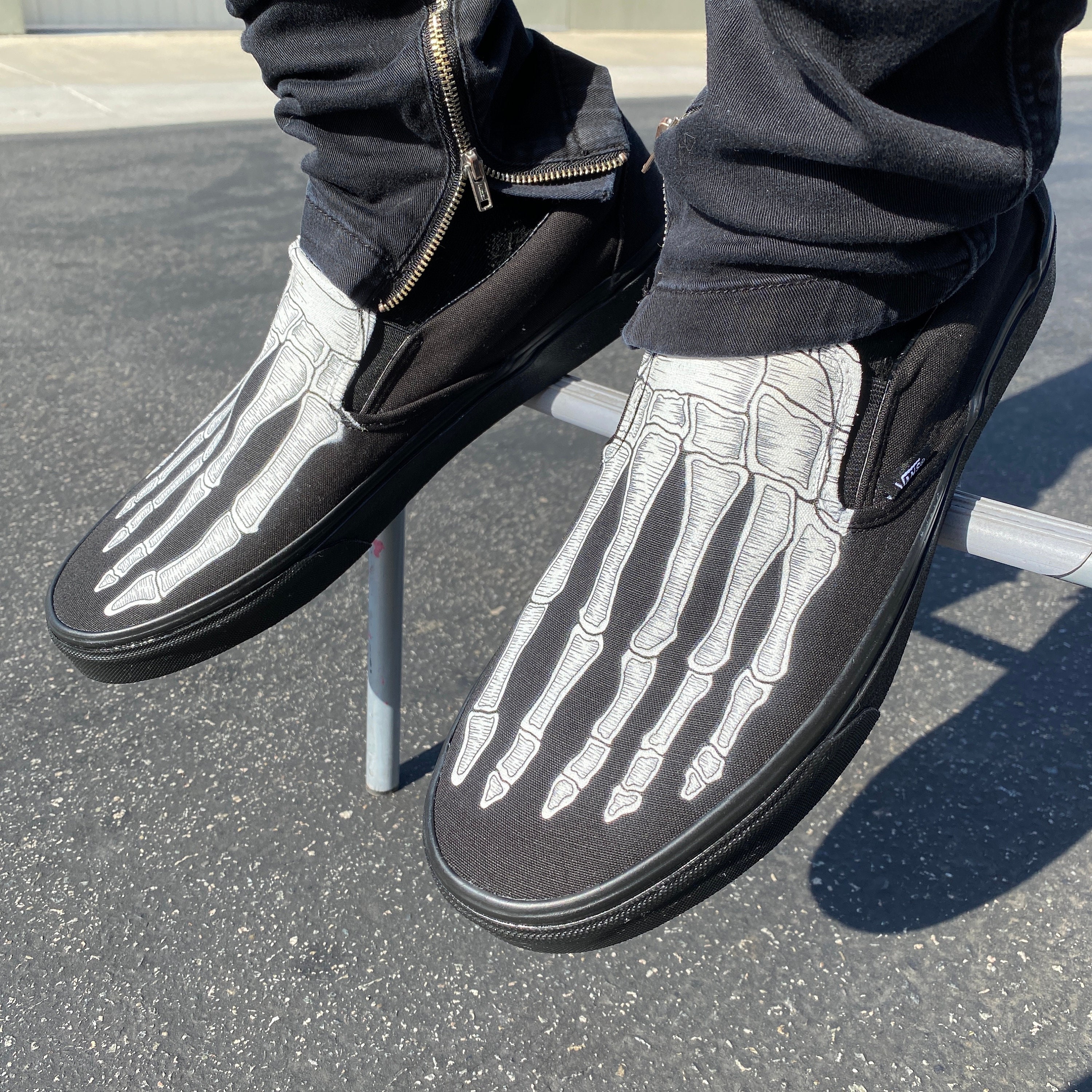 skeleton slip on vans