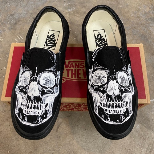 skeleton slip on vans