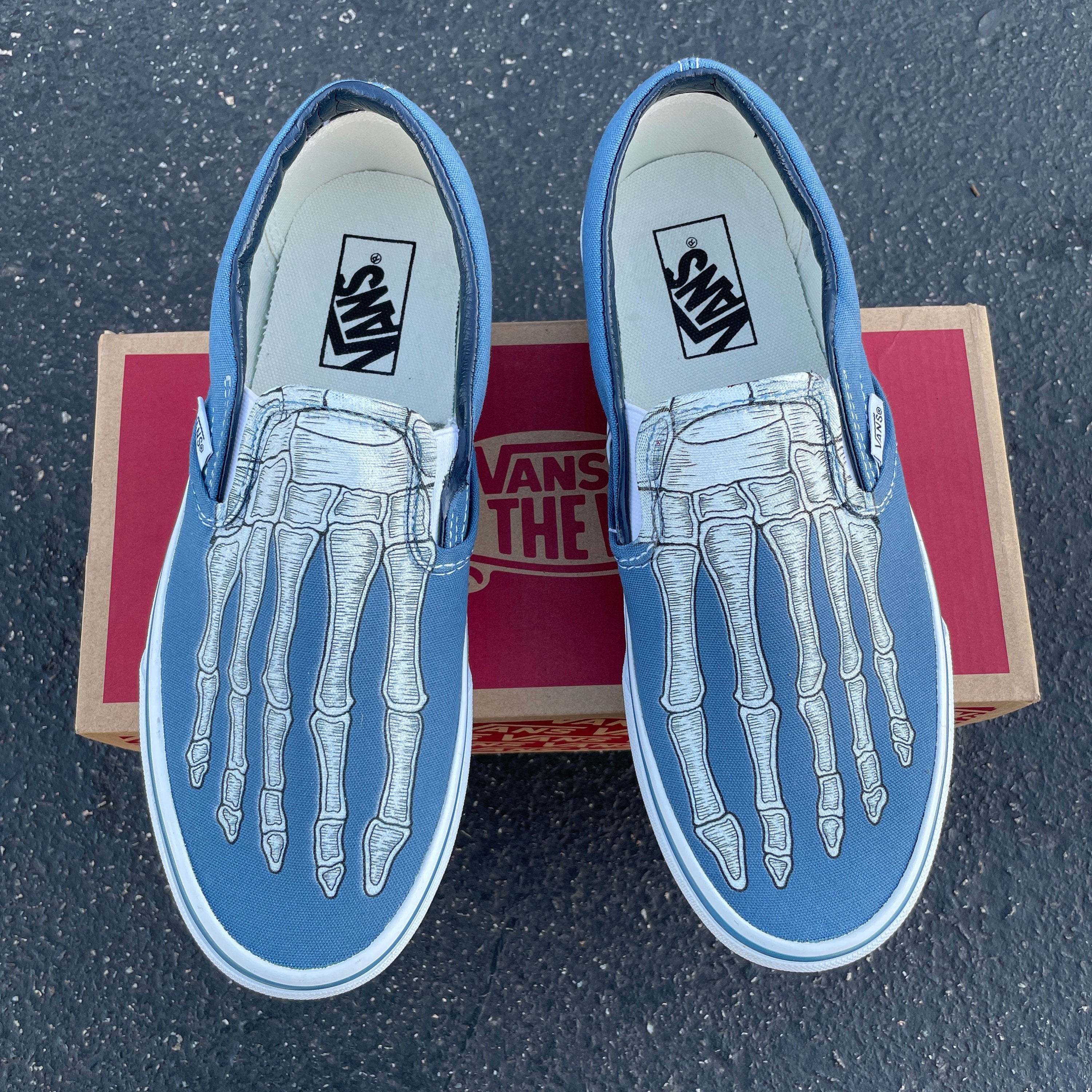 skeleton slip on vans