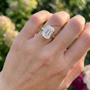 May include: A trio of ceramic mugs with a speckled, matte finish in cream, light grey, and dark grey. Each mug features a simple, minimalist design, ideal for tea or coffee.