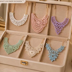May include: Six lace necklaces in white, pink, purple, mint green, cream, and light blue displayed in a beige jewelry box. Each necklace features intricate embroidery patterns, including geometric, floral, and knot designs with gold chains.