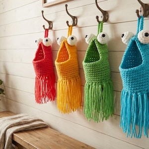 May include: A set of three ceramic mugs with a speckled, matte finish. The mugs are in shades of cream, light gray, and dark gray. Each mug has a simple, minimalist design and a rounded handle.