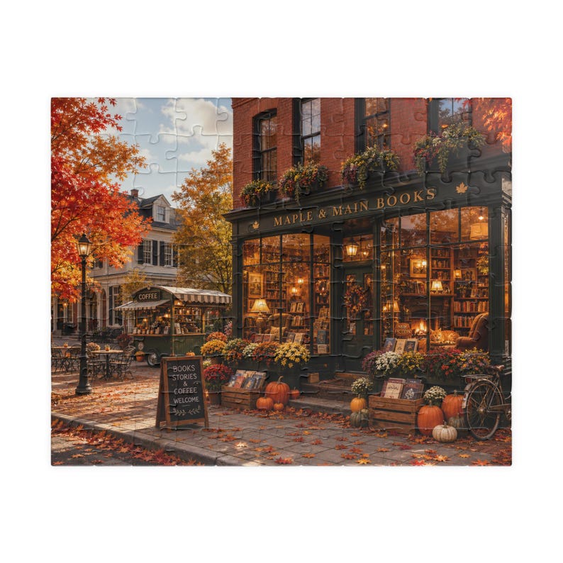 Step into the warmth and charm of autumn with this beautiful Cozy Fall Bookstore Puzzle. Featuring a welcoming independent bookshop glowing with golden light, colorful fall foliage, pumpkins, flower boxes, and a quaint coffee stand, this inviting Main Street scene captures everything readers love about the cozy season. Perfect for book lovers, puzzle enthusiasts, and fans of autumn décor, this detailed puzzle creates an immersive experience filled with charming details around every corner.