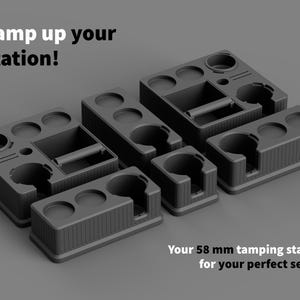 May include: A collection of dark gray tamping stations with various compartments and a handle. The text "Tamp up your station!" is at the top, and "Your 58 mm tamping station for your perfect setup" is at the bottom.