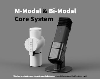 May include: Two coffee-related devices are displayed against a gray background. The text "M-Modal & Bi-Modal Core System" is at the top. One device is white with the name "PIETRO" on it. The other is black and gray.