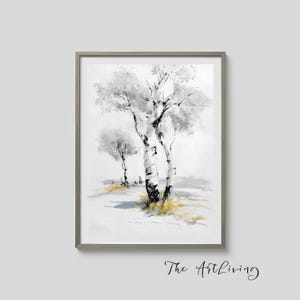 May include: Framed watercolor painting of birch trees in a winter landscape. The artwork features white and gray trees with black accents against a soft, white background. The painting is framed in a gray wooden frame. The Art Living is written in cursive at the bottom.