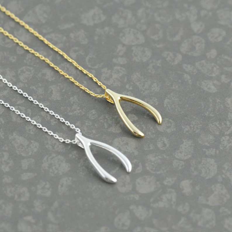 Gold Wish Bone Necklace. Wishbone Necklace in Gold. Jennifer Aniston
