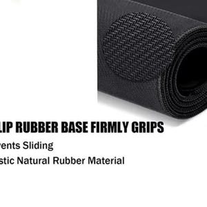 May include: A rolled black mat with a textured surface and a circular anti-slip pad. Text reads: ANTI-SLIP RUBBER BASE FIRMLY GRIPS, And Prevents Sliding, High Elastic Natural Rubber Material.