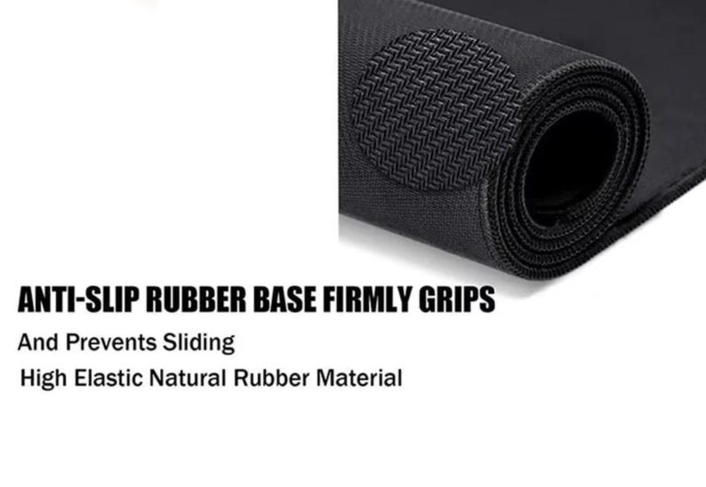 May include: A rolled black mat with a textured surface and a circular anti-slip pad. Text reads: ANTI-SLIP RUBBER BASE FIRMLY GRIPS, And Prevents Sliding, High Elastic Natural Rubber Material.
